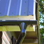 Rain Gutter Pipeline System Installation Roofing Construction Rain gutter system and roof protection from snow