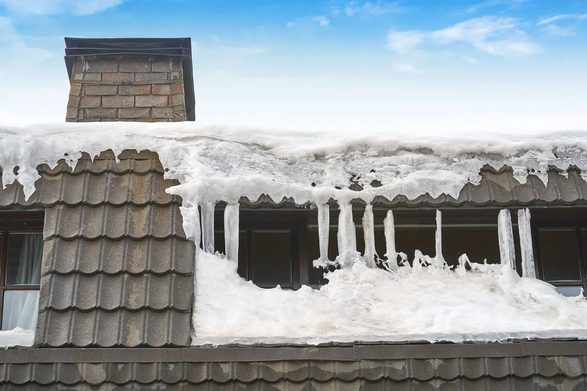 Heavy snow on residential roof top